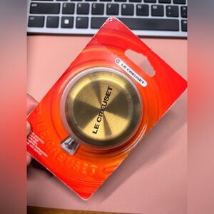 Le Creuset cookware knob.